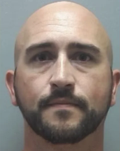 Booking photograph of Sergeant Mike Creeden, released after his arrest in June 2026.